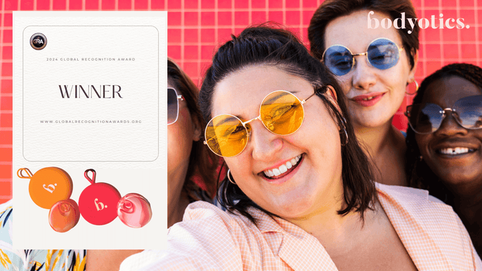 Smiling diverse women wearing sunglasses celebrating Bodyotics' 2024 Global Recognition Award for innovative women's health menstrual care solutions.