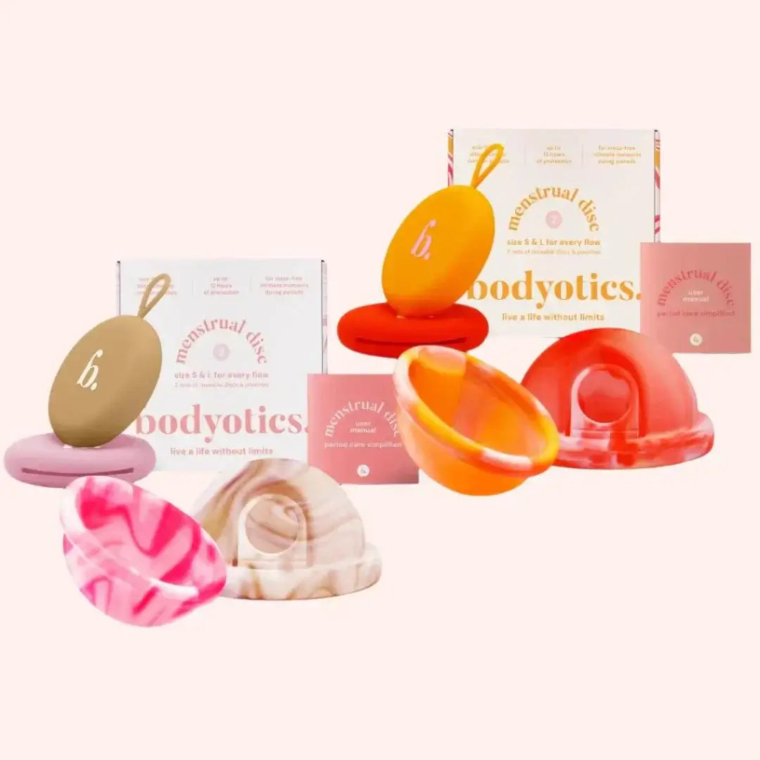 Bodyotics reusable menstrual disc value pack with small and large sizes in neutral beige and vibrant orange, including discreet carry pouch.