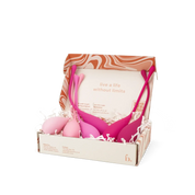 Bodyotics Kegel balls set with six graduated pelvic wellness weights in pink shades, packaged in a decorative box.