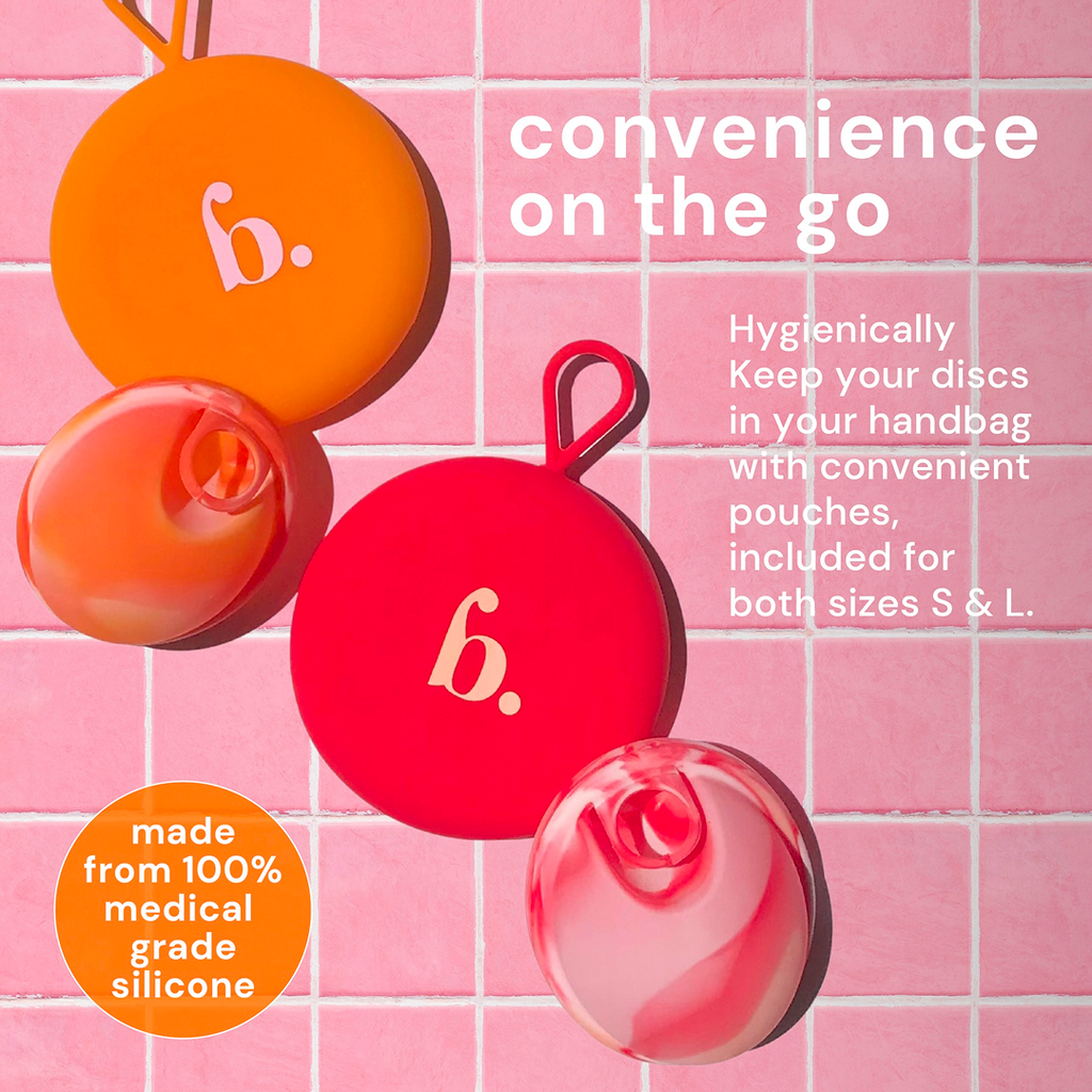 Bodyotics Reusable Menstrual Discs with carrying pouches on pink tile background, made from medical grade silicone.