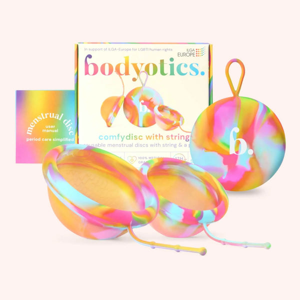 Bodyotics Comfydisc Rainbow Edition reusable menstrual discs with pull-off string and carrying pouch in vibrant rainbow colors